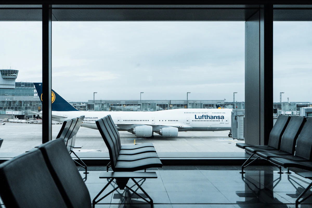 Departure gate seating at an international terminal looking out to a wide-body aircraft parked on stand