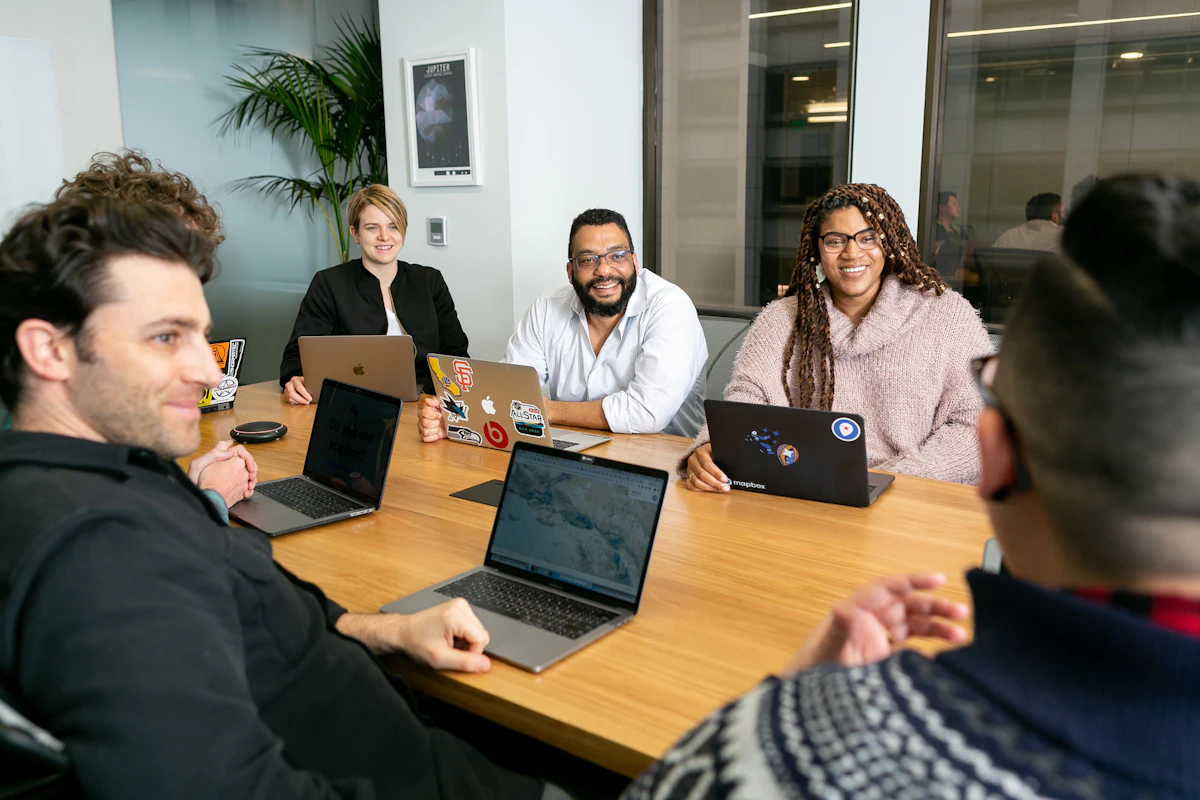 Visa counsellors reviewing application documents at a corporate desk