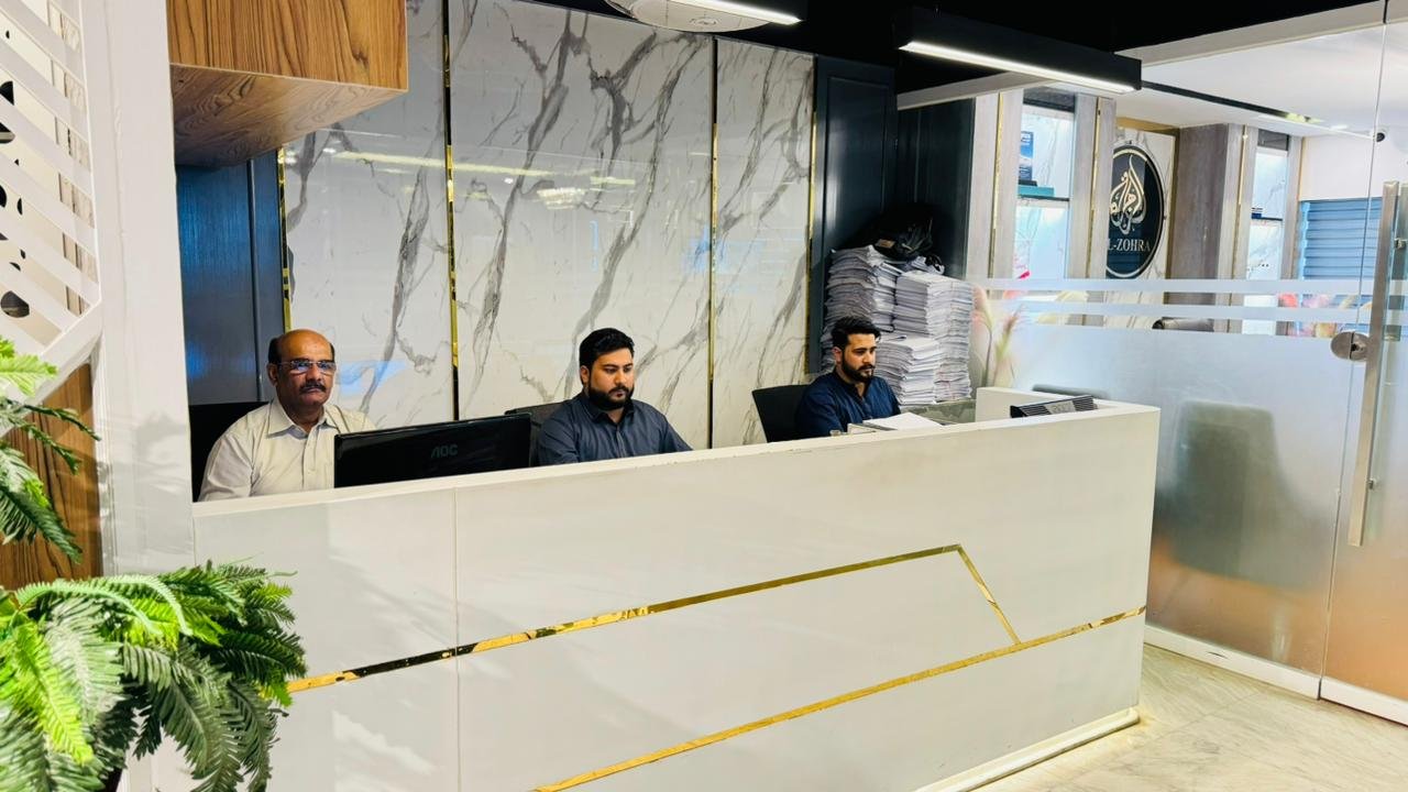 Reception area of the Al Zohra Travel & Tours head office in Blue Area, Islamabad